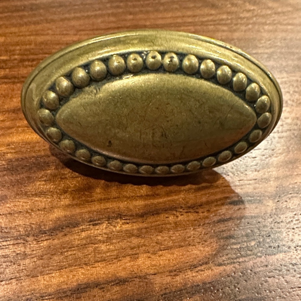 ANTIQUE BRASS OVAL DOOR KNOB WITH BEADING